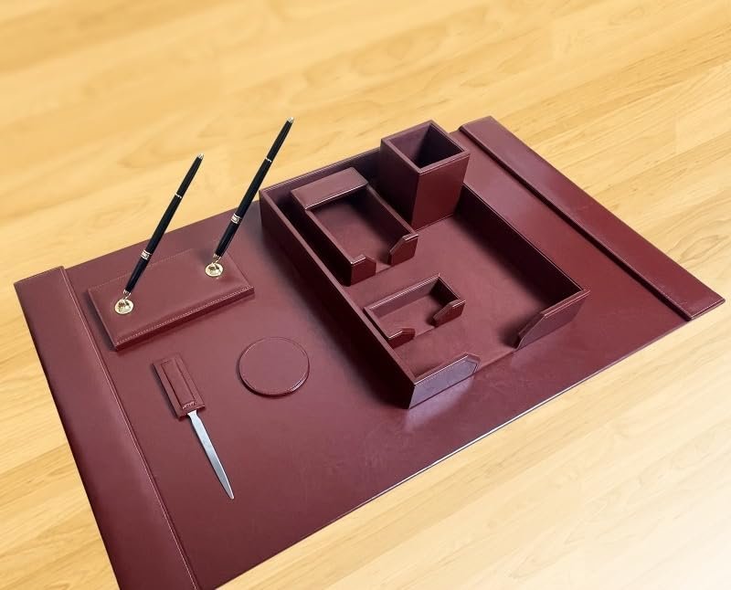 Burgundy leather desk set with pens, letter opener, and organizer trays