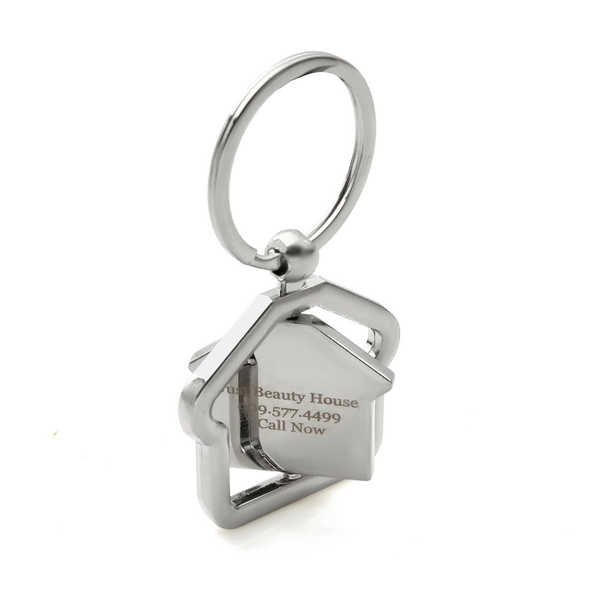 Silver house-shaped keychain with "Beauty House" and phone number engraved