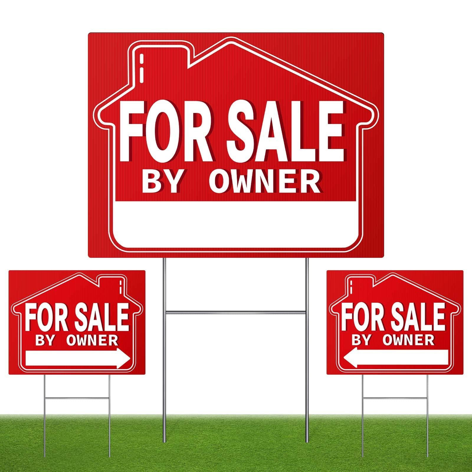 Three red "For Sale By Owner" signs on a green lawn