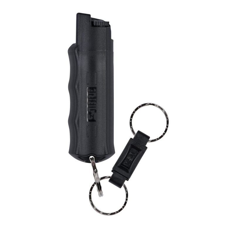 Black Sabre pepper spray with keychain attachment, isolated on white
