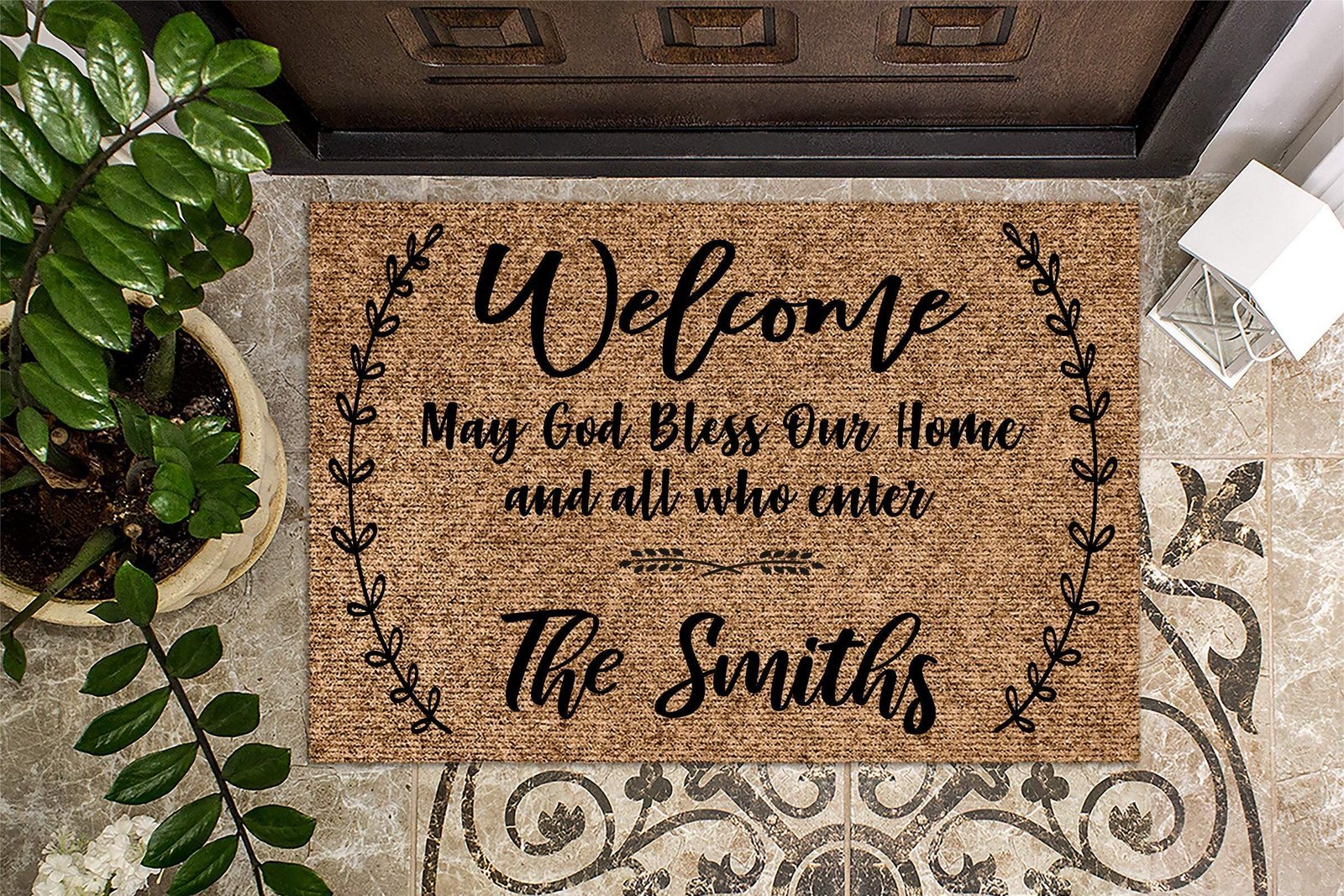 Welcome mat with family name and religious message in front of door